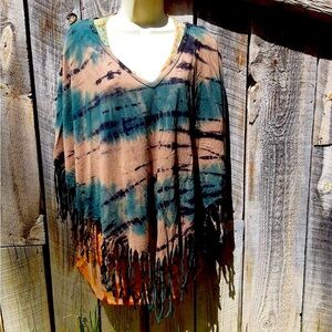 Camo woman’s light weight poncho by Urban X. Size L